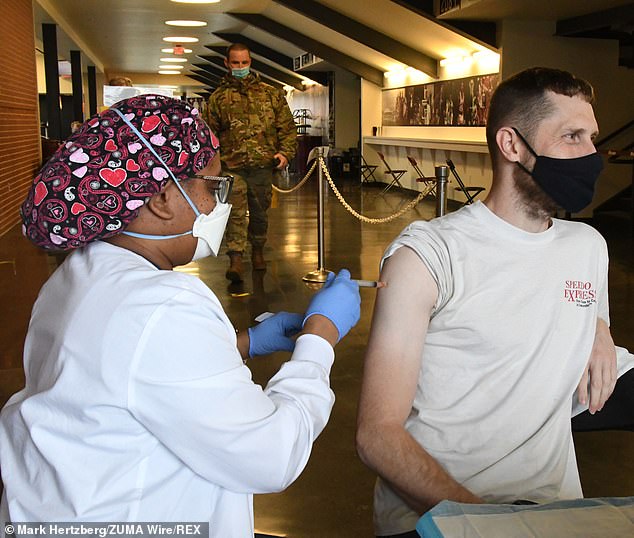 James Hubbard is seen in Carbondale, Illinois, being vaccinated on Thursday