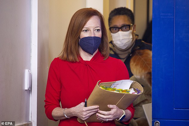 White House press secretary Jen Psaki, who has been vaccinated, wears a mask